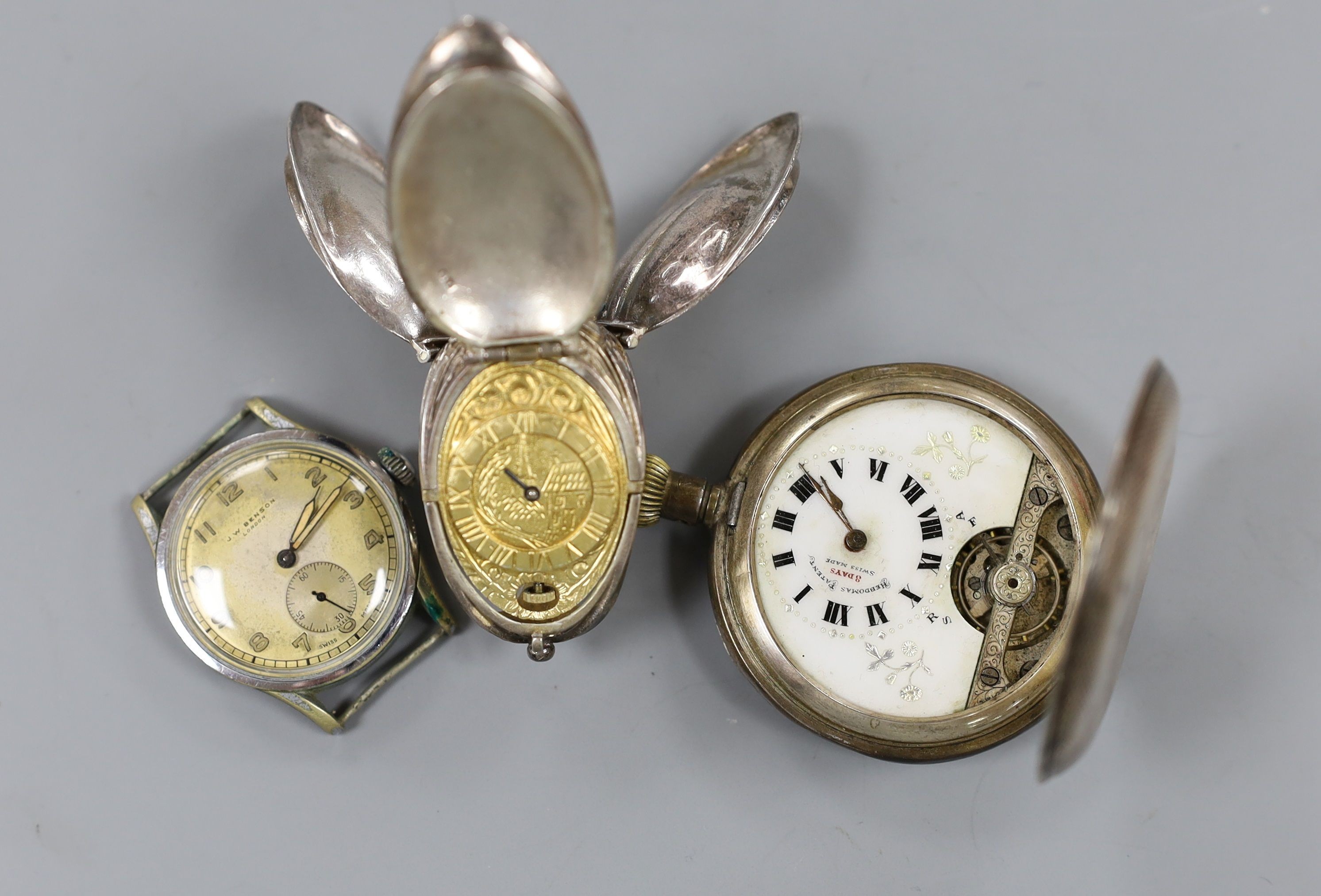 A gentleman's steel manual wind wrist watch, retailed by J.W. Benson, two other watches including silver pocket watch and a Rolex box.